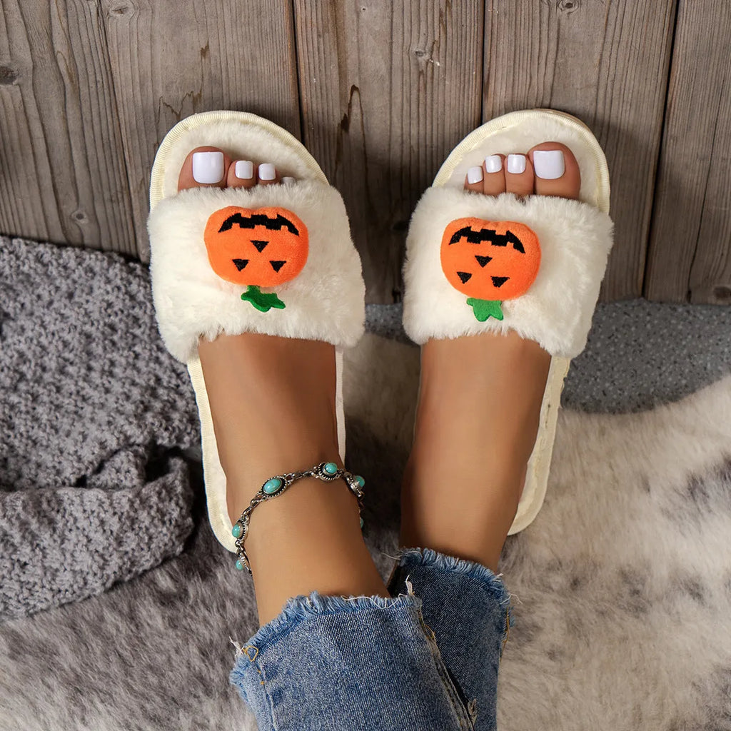 White and yellow pumpkin plush open toe slippers with cartoon Halloween design on synthetic fur