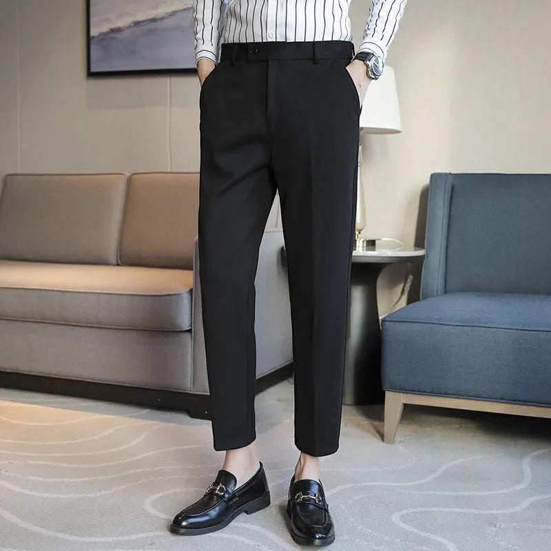 Straight cut brown corduroy trousers with elastic waistband shown front and back views