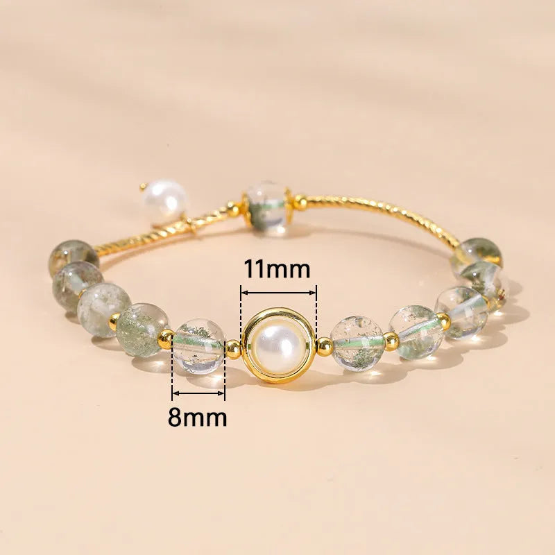 Crystal agate charm bracelet with Chinese-style fruit, bow, and animal designs in natural crystal colours