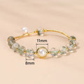 Crystal agate charm bracelet with Chinese-style fruit, bow, and animal designs in natural crystal colours