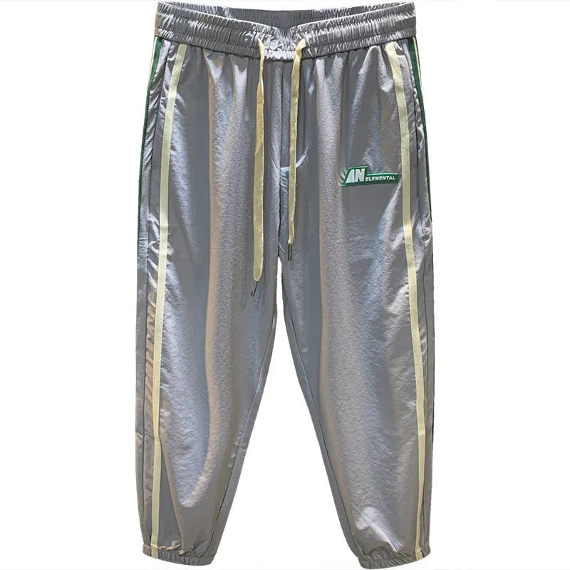 Men's solid colour cotton ice silk harem pants in black or grey with loose fit and trousers length