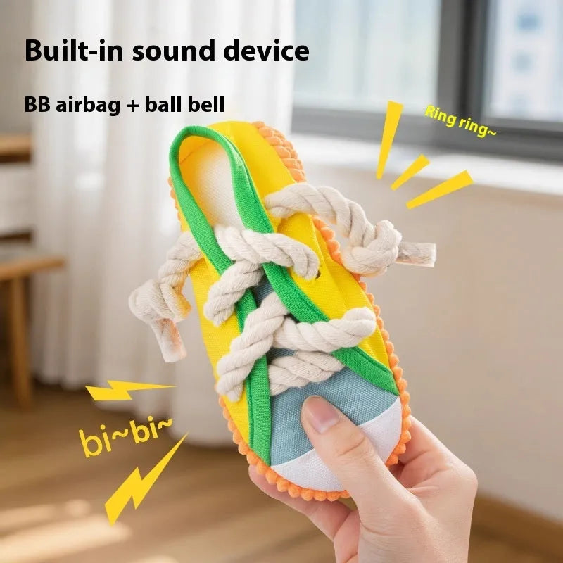 Plastic slipper-shaped dog chew toy with squeaker in yellow, black, or blue.