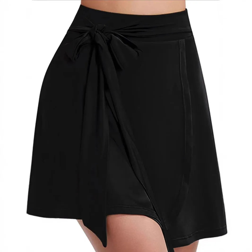 Black thigh-length sports skirt with built-in shorts and high waist design