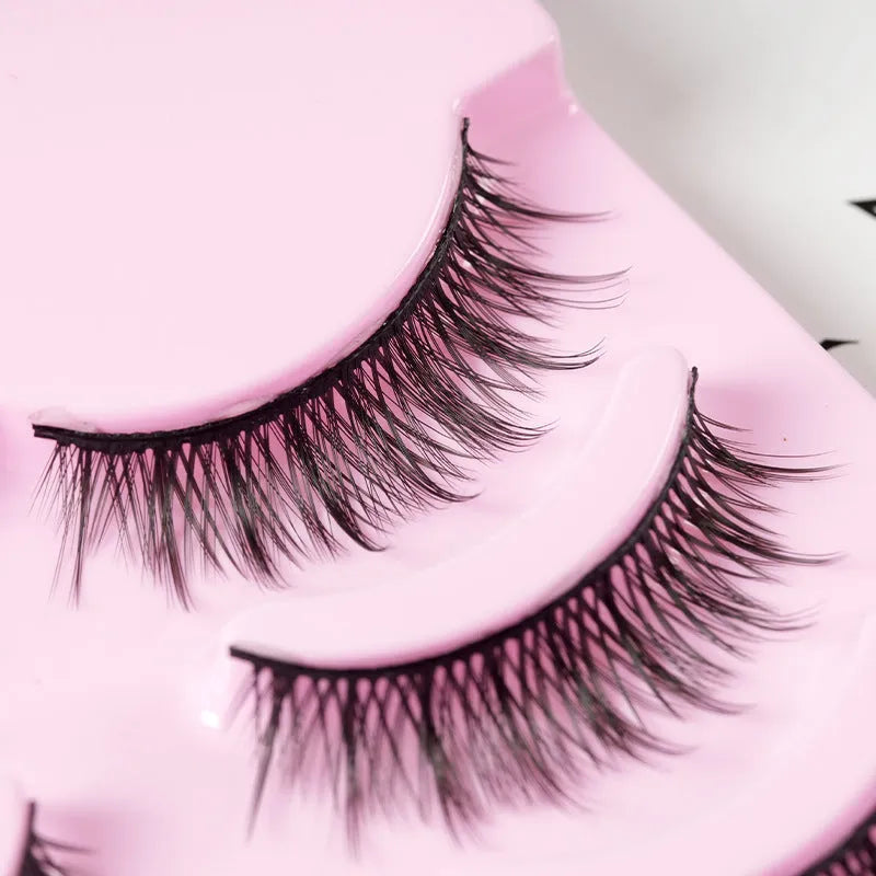 5 pairs of natural wispy manga false eyelashes on a black background, showing styles 007, 008, and 009 with plastic black terrier.