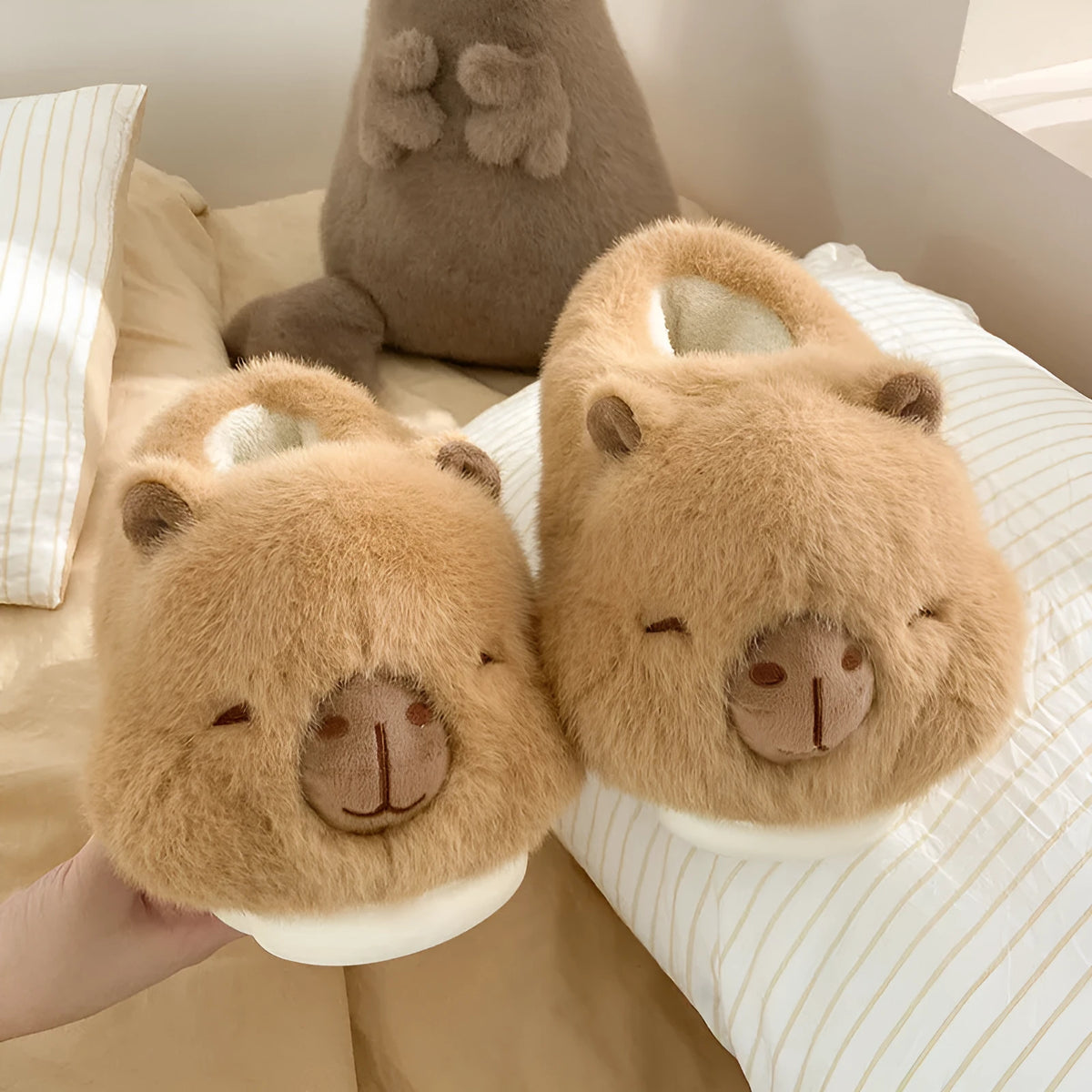 Light brown women's winter plush slippers with a cartoon pattern and artificial wool lining.