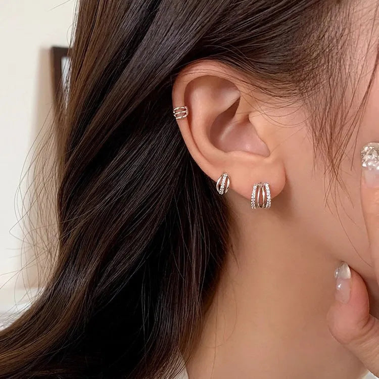 A pair of geometric-style 925 sterling silver earrings with an ethnic design, shown on a white background.
