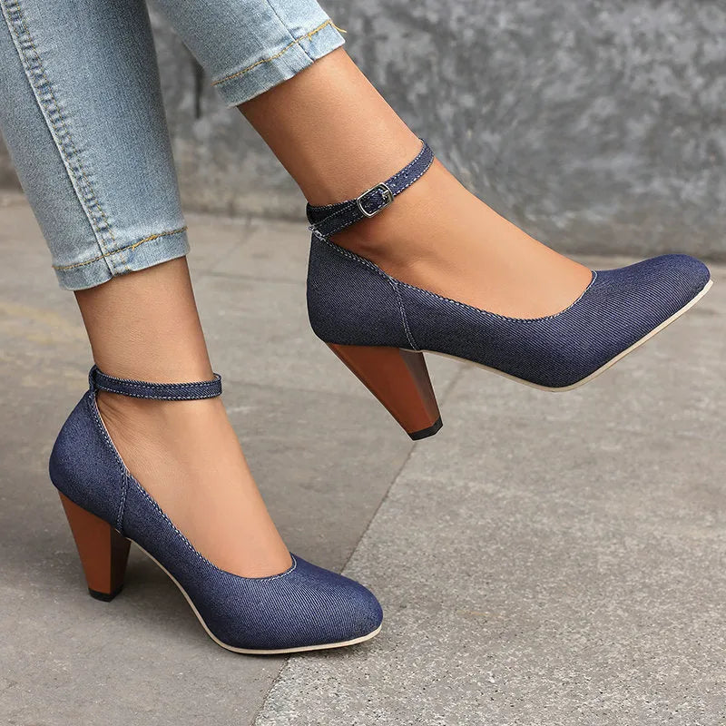 Blue denim women's high heel ankle boots with a silver buckle and waterproof platform sole.