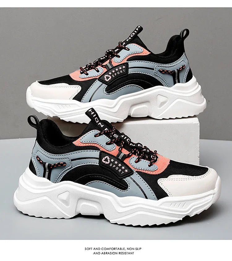 White women's casual sports shoes with mesh upper, thick PU sole, round toe, and buckle detail.