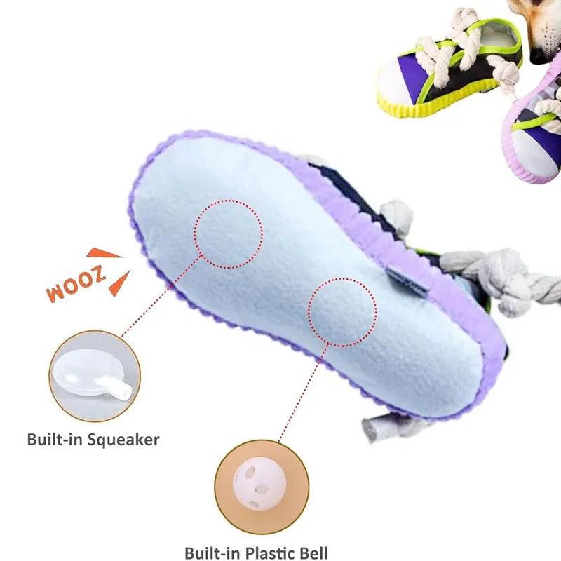 Realistic shoe-shaped dog toy in grey, purple, or yellow with laces, sole patterns, built-in squeaker and bell.