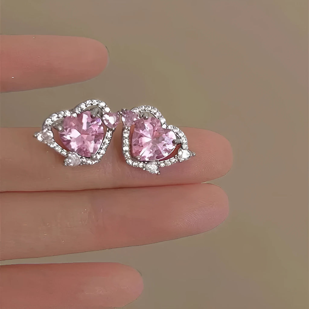 Heart shaped stud earrings with white k finish and copper construction for women