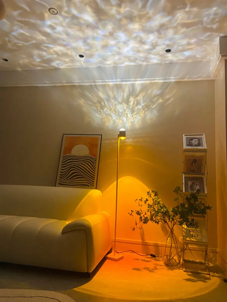 Modern sunset red floor lamp projecting a water ripple pattern on a wall.