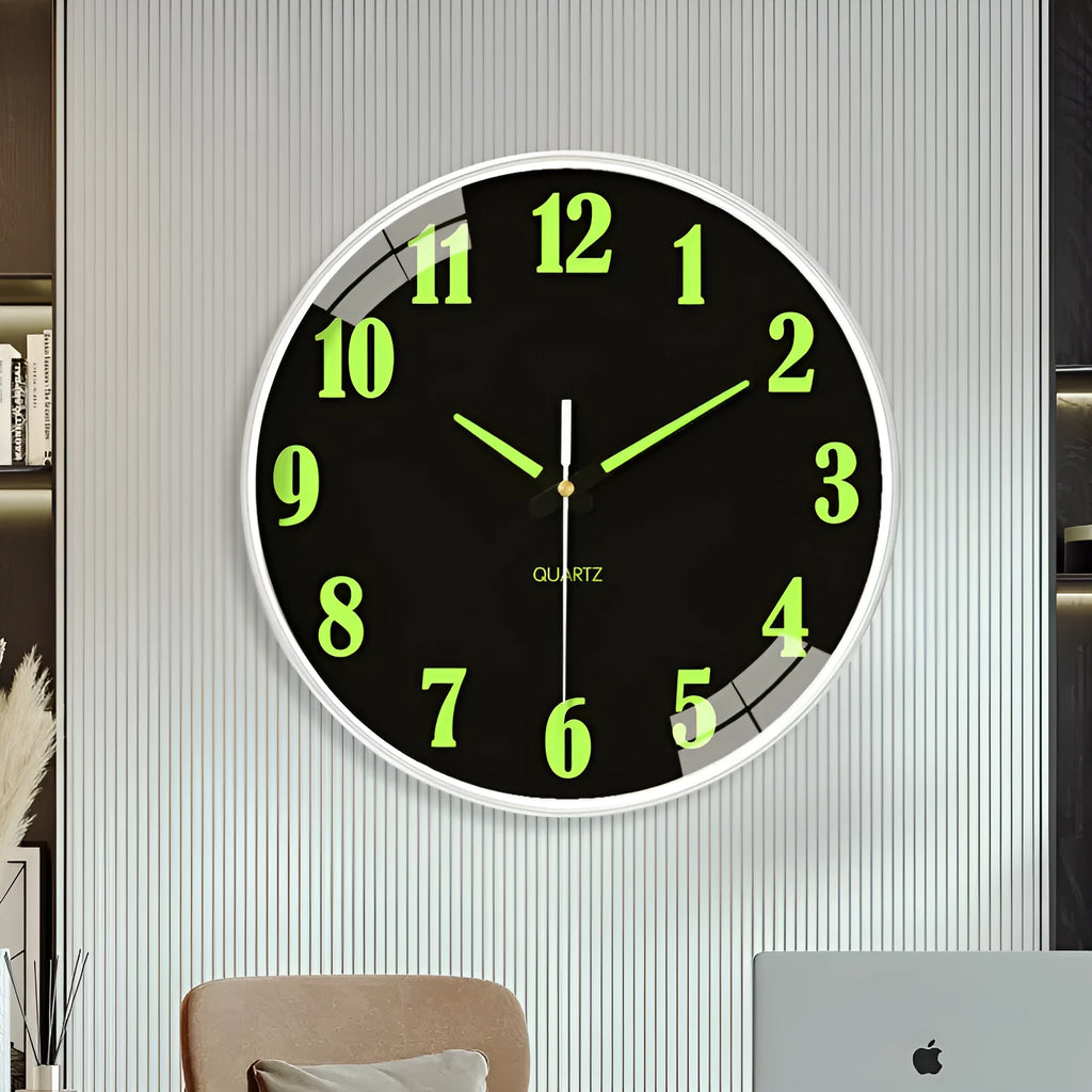Modern 8-inch luminous wall clock with white plastic case on a wall.