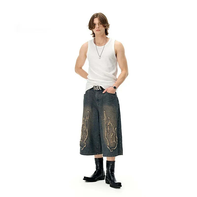 Cropped men's denim shorts with flame embroidery patch in straight-leg cut for summer street style