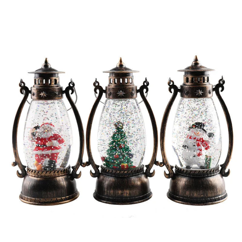Clear plastic crystal ball oil lamp with LED light, showing snowman and elderly figure design options.