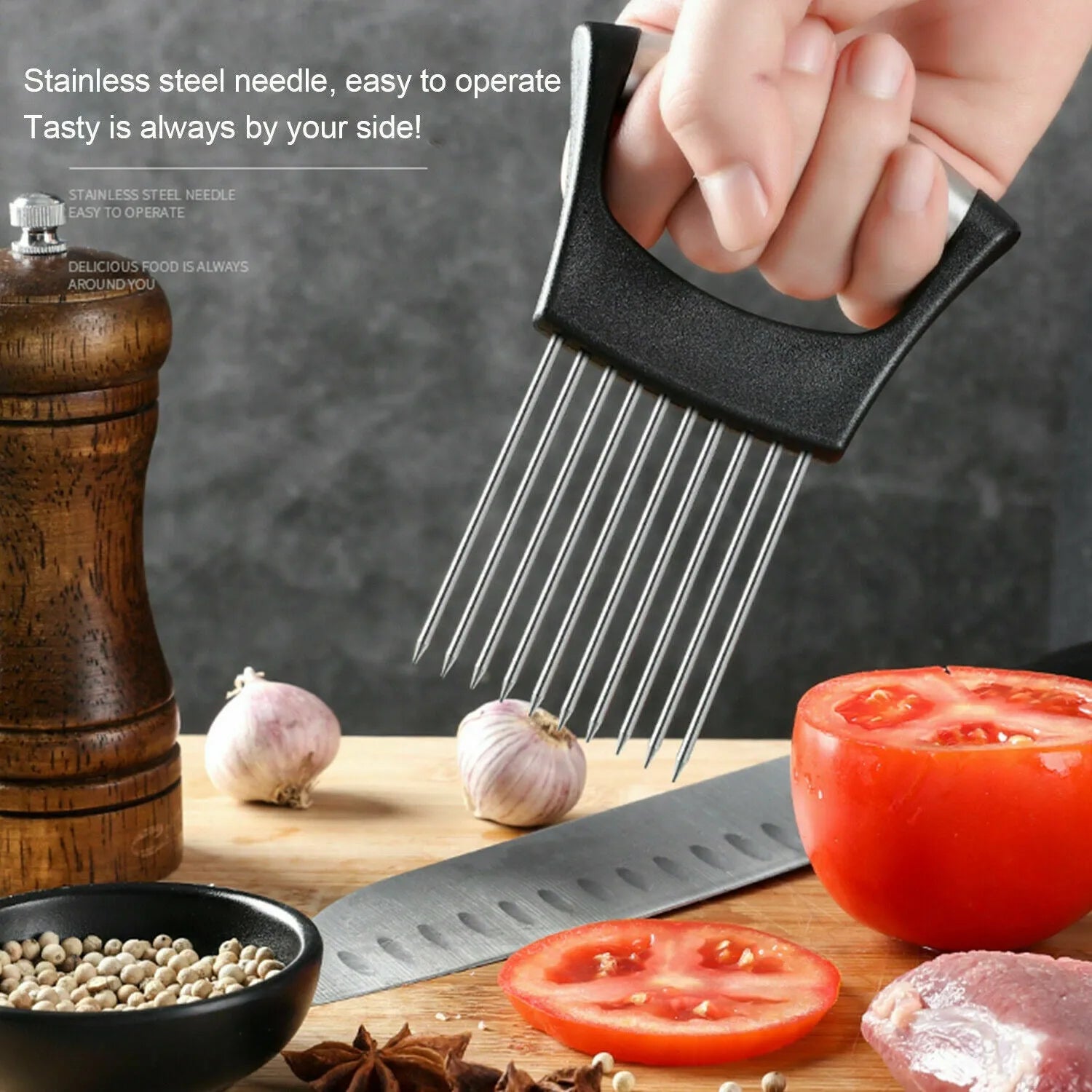 Stainless steel onion and tomato slicer holder with ABS handle on a kitchen worktop