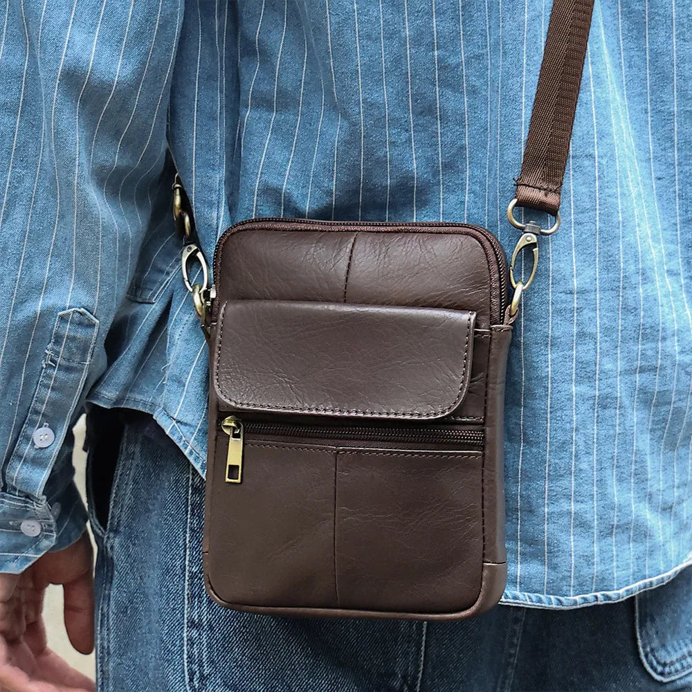 Men's brown genuine leather crossbody shoulder bag with sewn detailing and a shoulder strap.