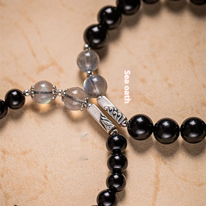 Obsidian Buddha beads couple bracelet set showing 8mm women's and 10mm men's sizing in national style