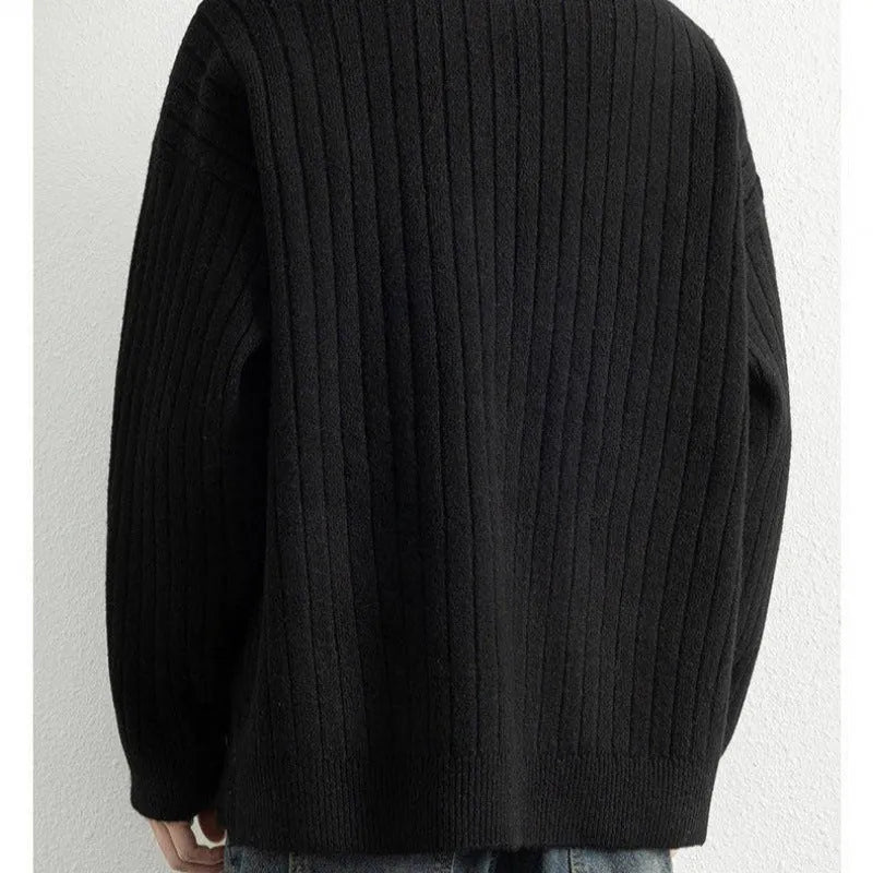 Men's grey half zip textured knit sweater with a loose fit and long sleeves.