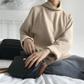 Women's loose fit half-high collar long sleeve top in solid colour on a hanger.