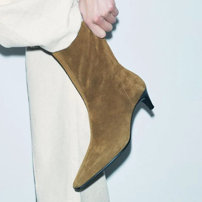 Brown square toe ankle boots with side zip and a mid stiletto heel on a waterproof platform sole.