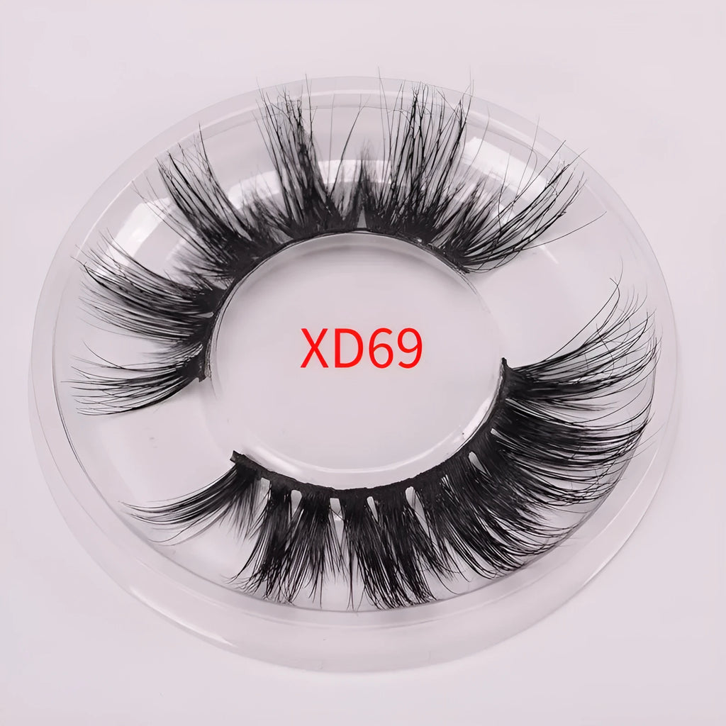 5D mink false eyelashes with protective hair cap and double-headed brush on white background