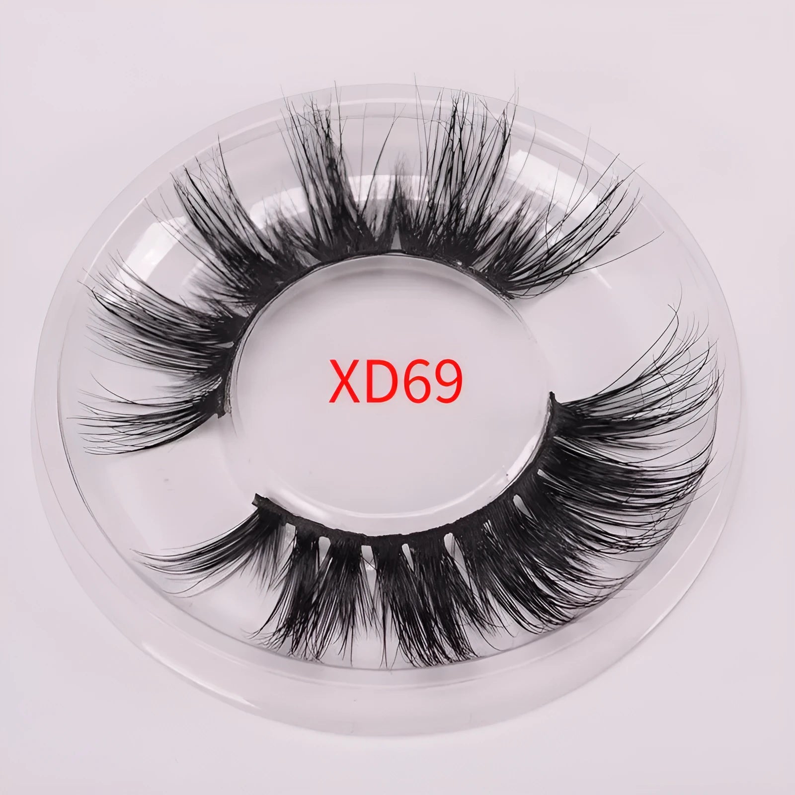 5D mink false eyelashes with protective hair cap and double-headed brush on white background