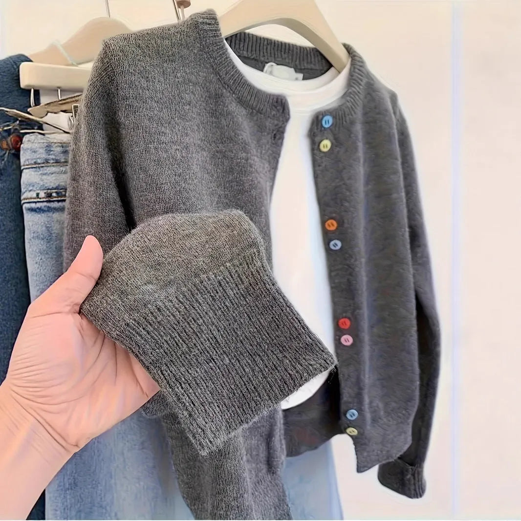 Dark grey solid colour women's cardigan with button front and long sleeves.