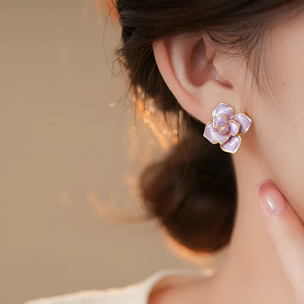 Gold plated purple oil-spot glaze floral stud earrings on copper base.