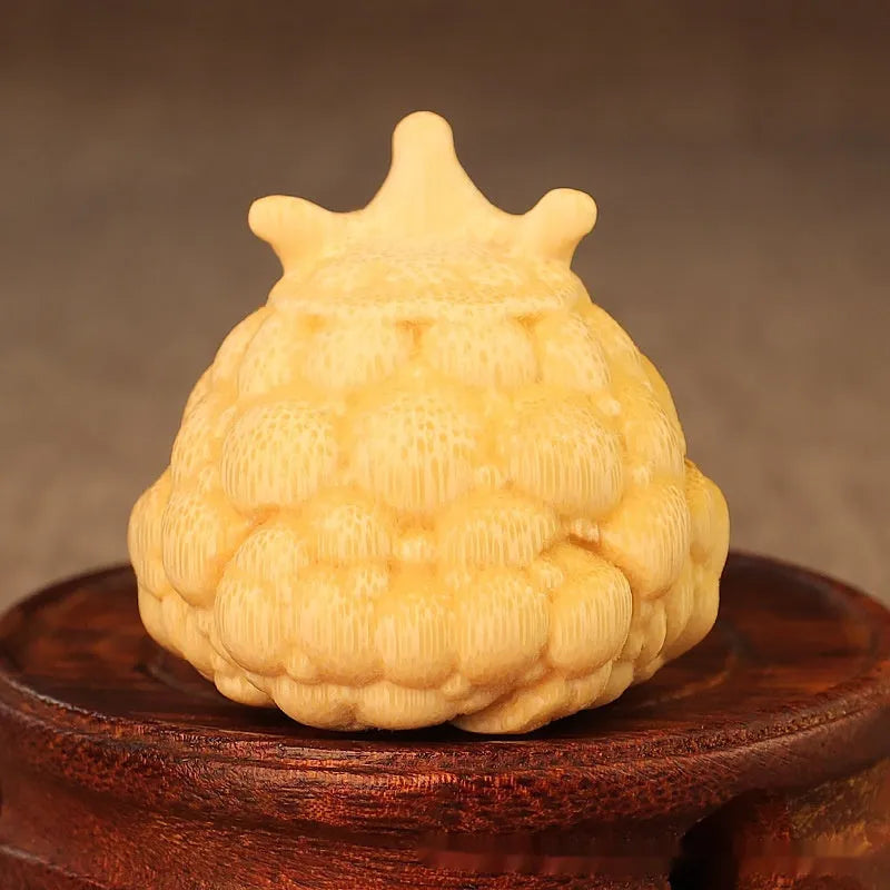 Solid bamboo Crown Princess Toad carving ornament in cute style on a plain background.