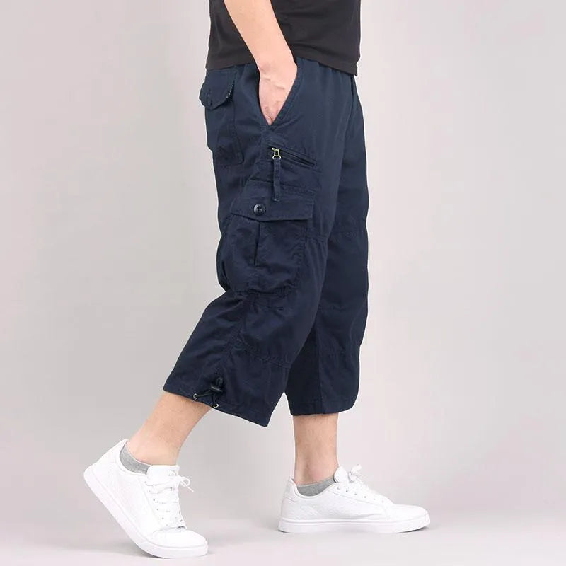 Man wearing loose-fit khaki cotton cropped casual shorts for sports.