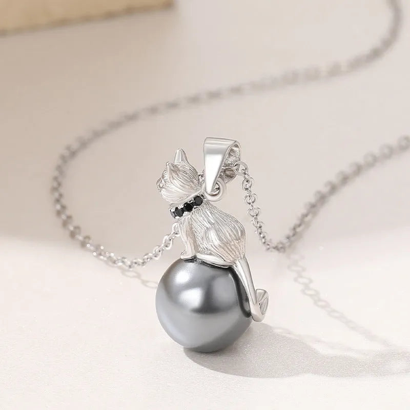 Sterling silver cat pendant necklace with adjustable chain, showing delicate feline silhouette charm