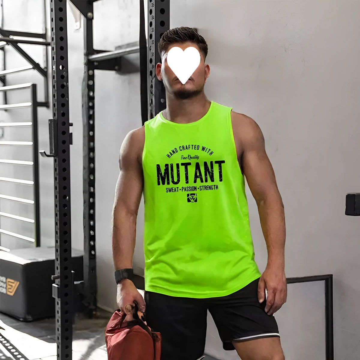 Man's loose fit grey polyester sleeveless training vest for fitness.