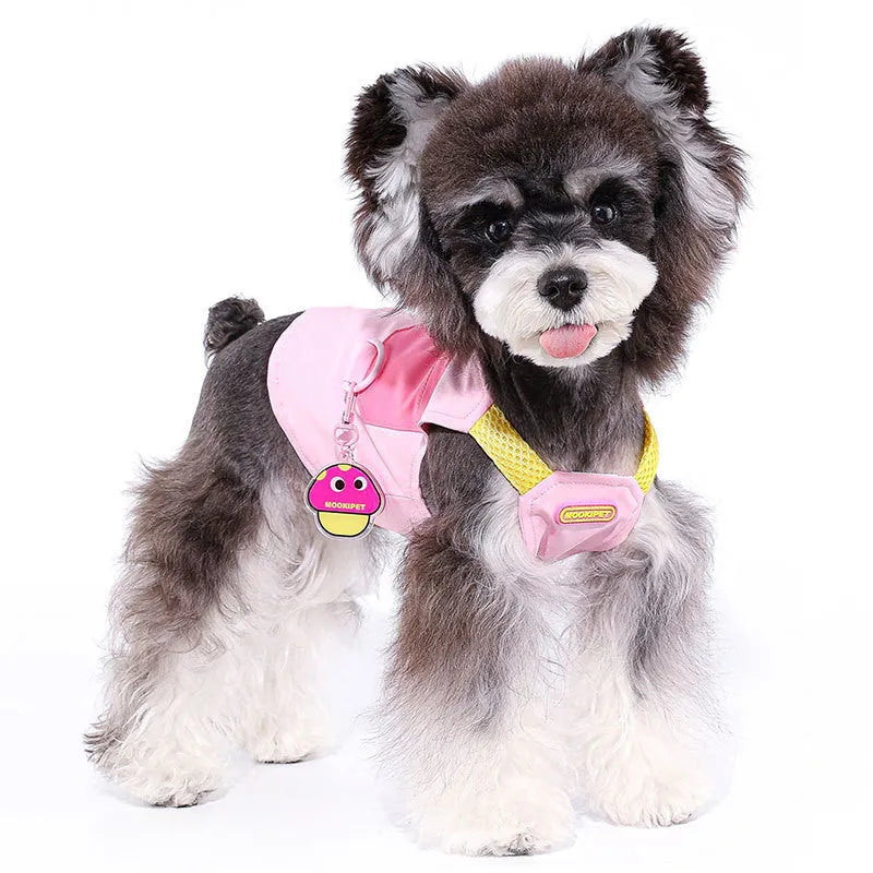 Pink polyester traction vest for a small white dog on a grey background.