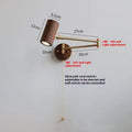 Retro-style wooden and iron wall lamp with a long, rotating arm and integrated switch.