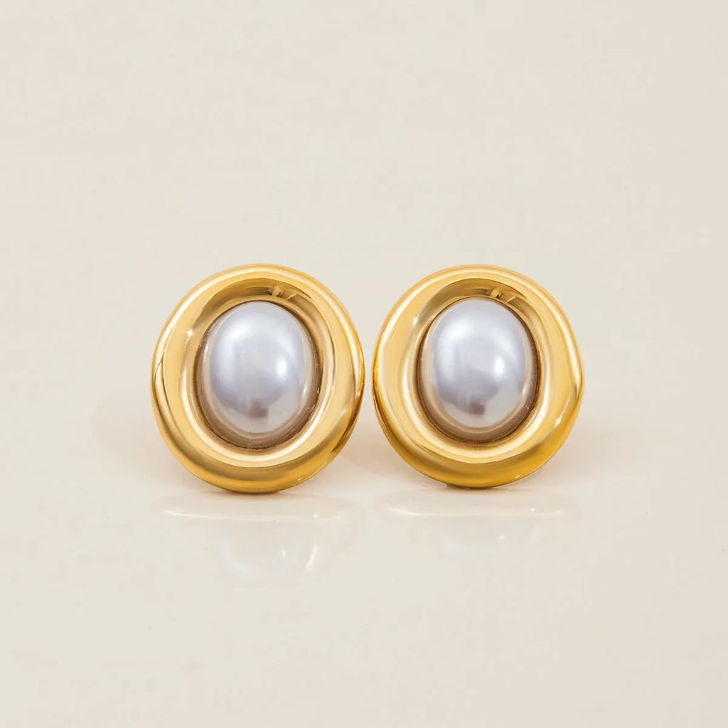 A pair of stainless steel vintage pearl stud earrings with an electroplated silver-coloured finish.