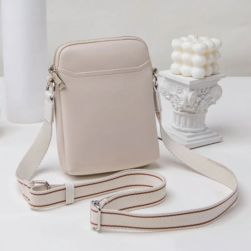 Small solid colour PU leather crossbody shoulder bag for women in beige, black, green, or khaki.