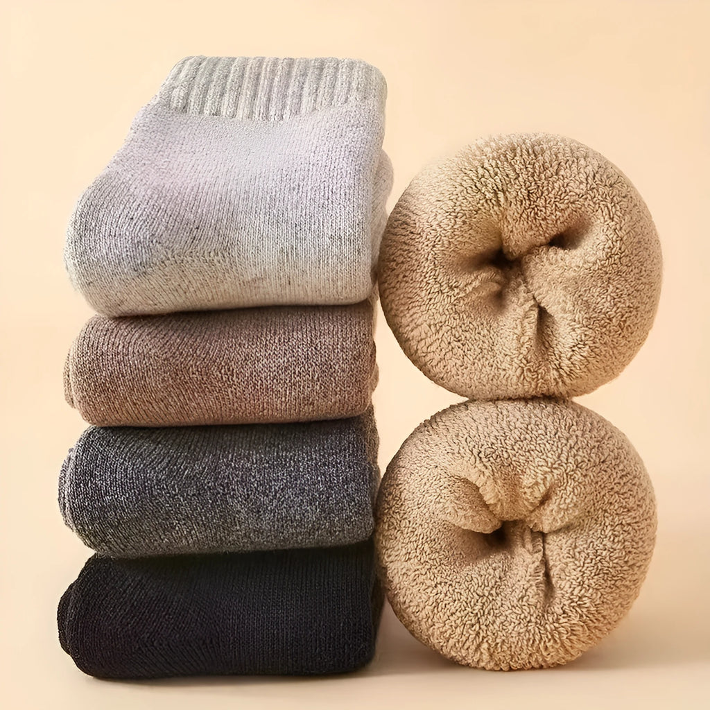 Pair of thick wool socks with a merino midsole in a solid cashmere colour.
