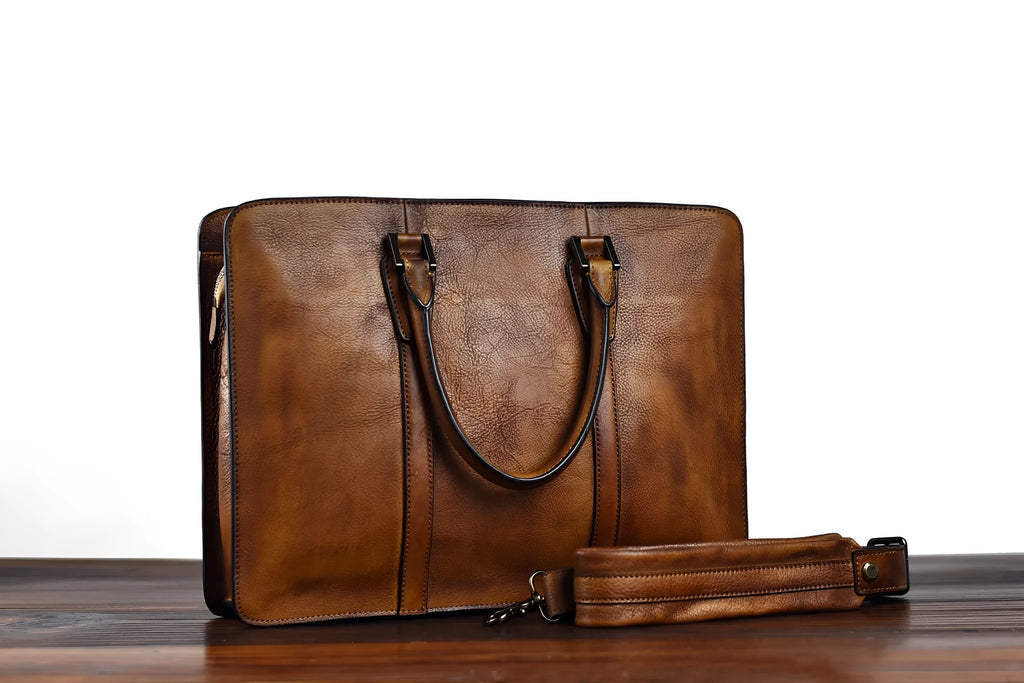 Men's brown leather horizontal square handbag with zipper opening showing 14 inch size