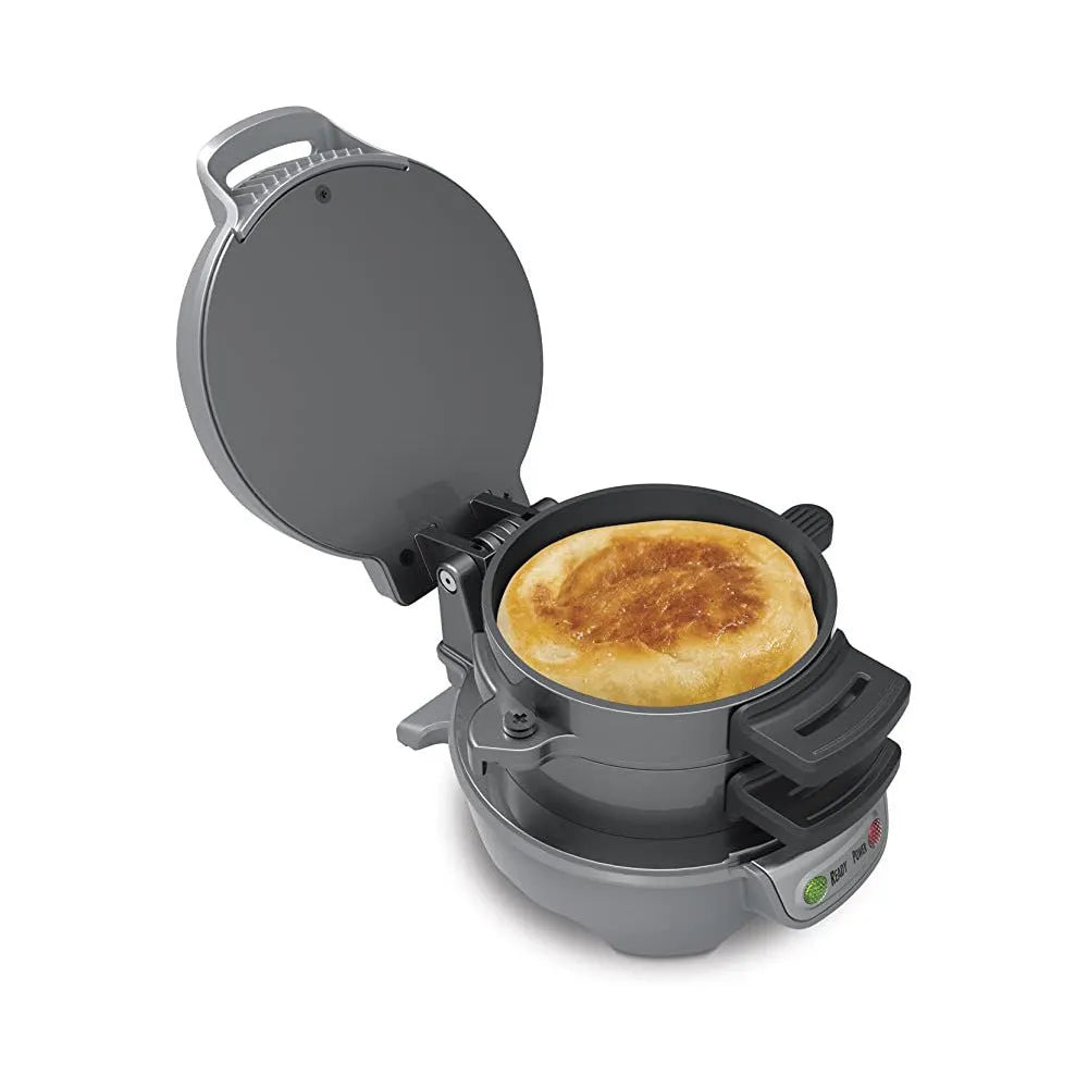 Bright red breakfast sandwich maker with egg cooker ring and waffle plates on kitchen counter