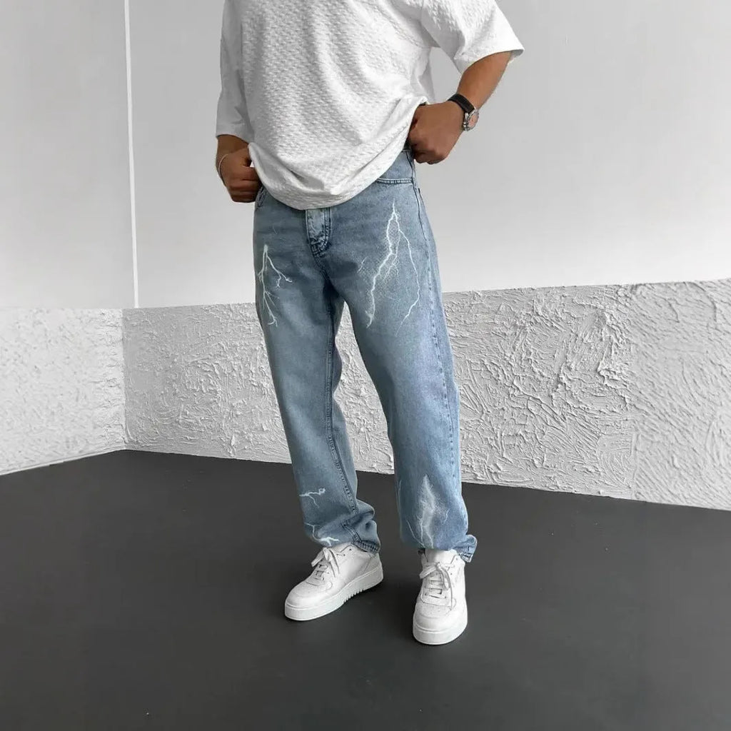 Blue men's straight-leg denim jeans with mid-waist fit and zipper fly displayed flat