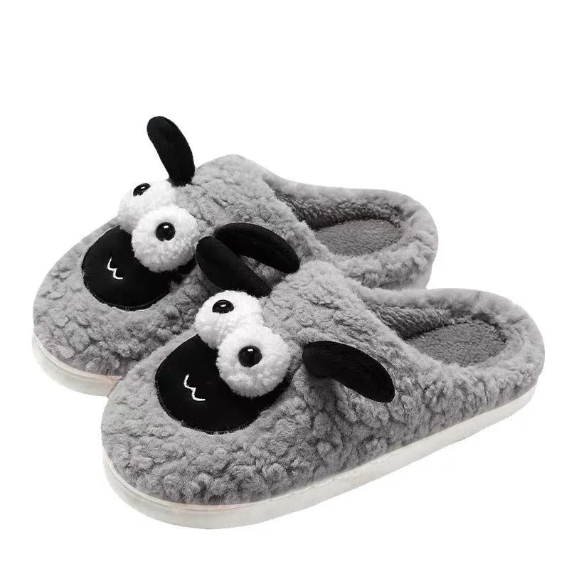 A pair of lamb thermal cotton slip-on slippers with a suede upper and sewn PVC sole.