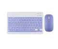 Compact white Bluetooth keyboard for tablet and PC use on a wooden desk