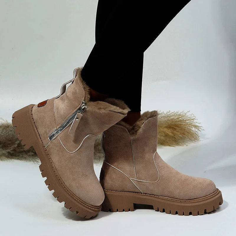 Women's black high-top snow boots with faux suede uppers, side zipper, and fluffy fur lining.