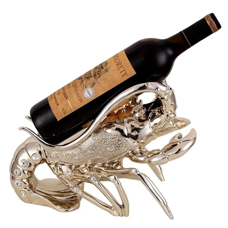 Lobster wine rack ornament in rose gold or silver metallic finish holding bottle