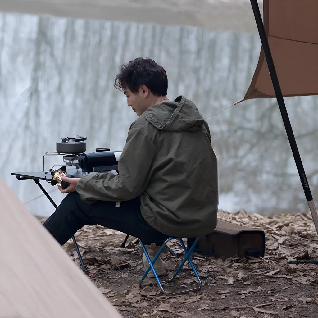Black aluminium alloy folding camping stool shown in open and folded positions.