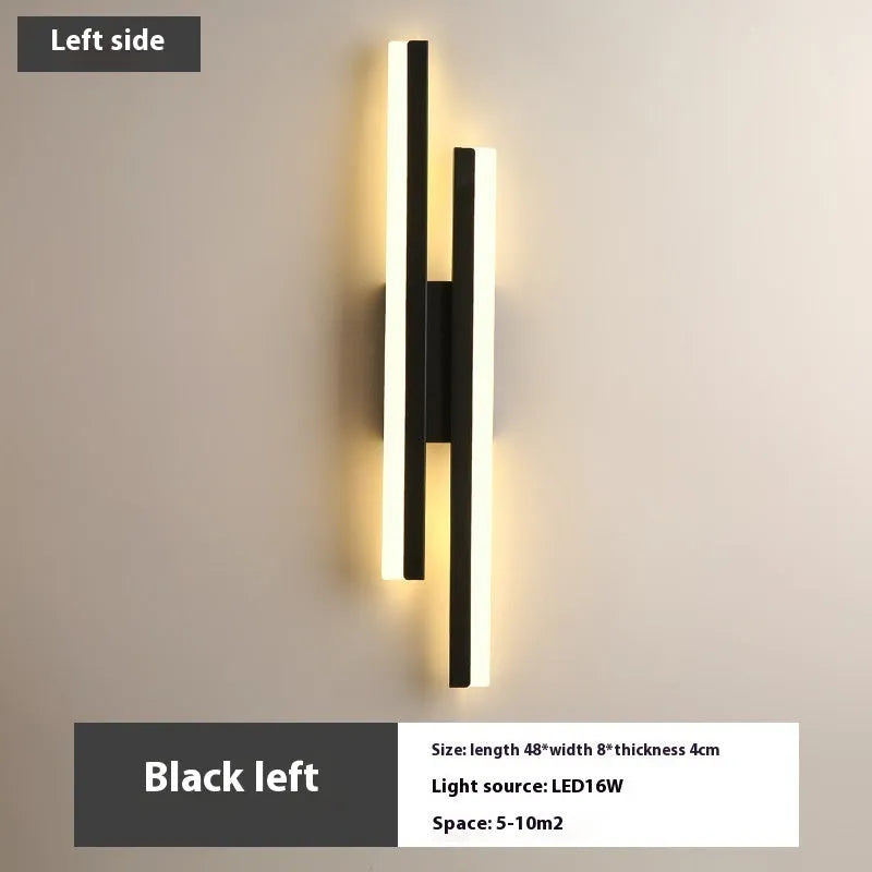 Scandinavian minimalist LED wall light with an acrylic shade on a black arm, mounted on a light-coloured wall.