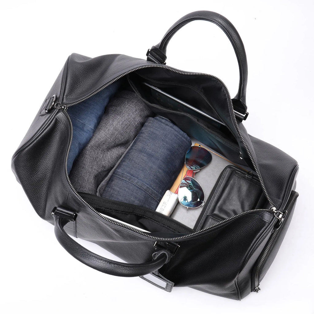 Men's black leather tote bag with single adjustable strap showing interior capacity