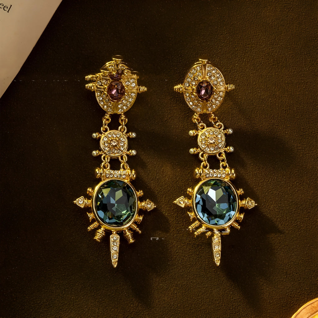 Geometric gold coloured retro stud earrings with round design elements on alloy stud backs