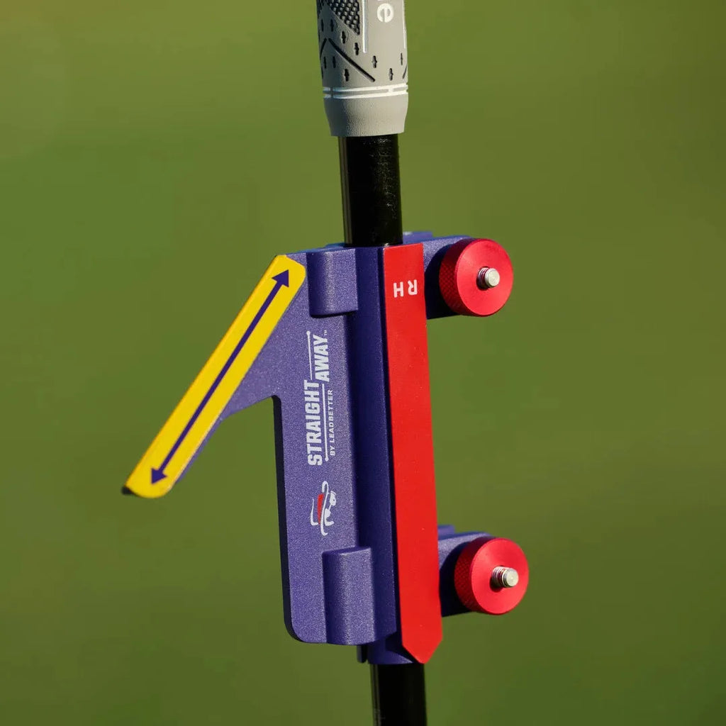 Plastic golf swing plane training simulator on a green background