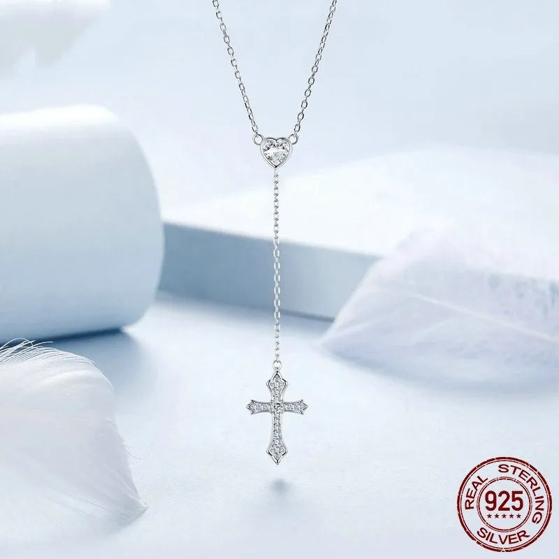 Silver V-neck Love Cross pendant on an O-ring chain necklace for women.